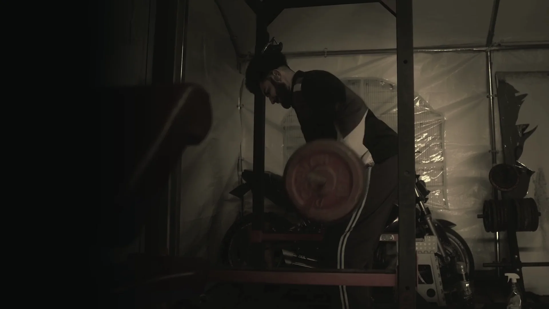 Deliberate strength training in a softly lit studio.